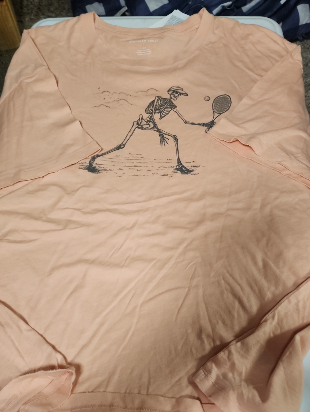 American Eagle Outfitters Peach Short Sleeve Tee with Skeleton Tennis Graphic